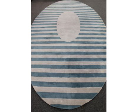 A Kinnasand oval woolen carpet on striped ground, 450 cm x 220 cm 