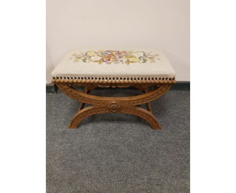 A continental carved oak tapestry seated stool, 62 cm x 36 cm 