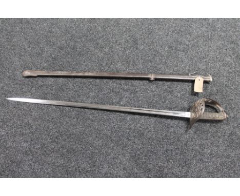 A British infantry officer's sword in sheath  CONDITION REPORT: Blade and scabbard a good fit. Scabbard and hilt are pitted. 