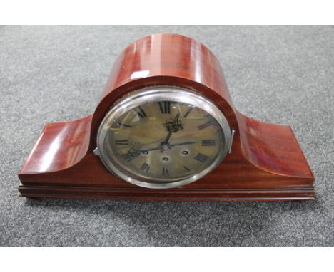 An antique mahogany Westminster chime mantel clock with silvered dial on raised feet 