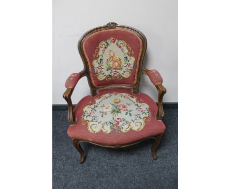 A beech framed armchair in tapestry fabric 