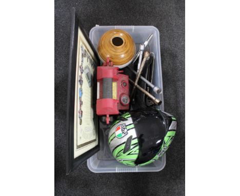 A box of jump starter, wheel braces, jack, motor cycle helmet etc 