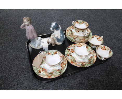 A tray of two Nao figures and six antique china trios 