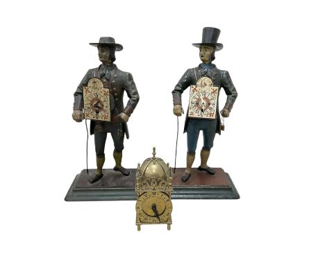 Two 29th century reproduction German traveling clockmaker figures and a small battery operated miniature lantern clock