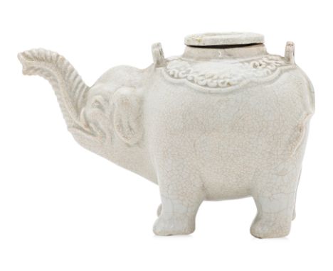 A BLANC DE CHINE PORCELAIN ELEPHANT FORM TEAPOT
Qing Dynasty, circa 19th Century, naturalistically modelled with its trunk ra