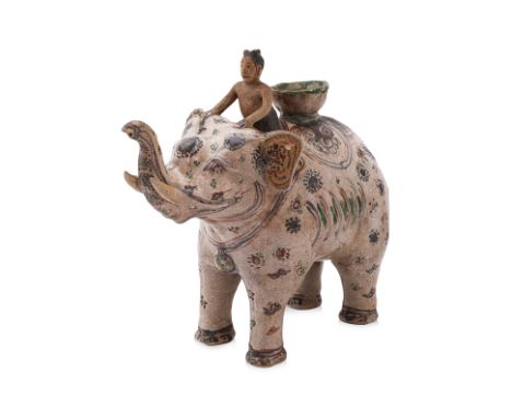 A LARGE VIETNAMESE POLYCHROME ELEPHANT EWER 15th Century, decorated in spotted designs with the smiling rider seated forward 