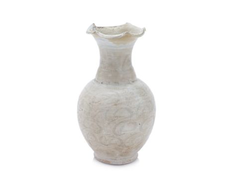 A COMBED QINGBAI VASE WITH CLOUD MOTIFS Song Dynasty, rounded sides and trumpet neck to a frilled five-petalled mouth rim, th
