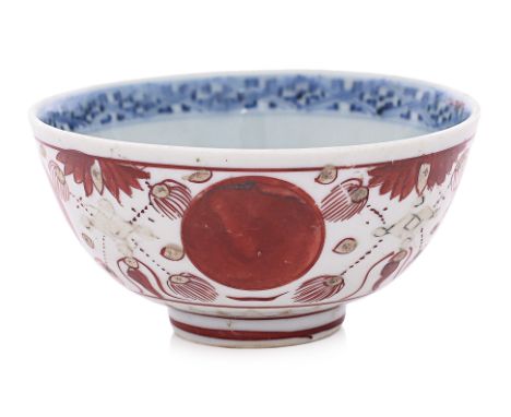 A BLUE AND WHITE KINRANDE TYPE BOWL
Ming Dynasty, decorated with a peony and scroll medallion to well and lattice band, the o