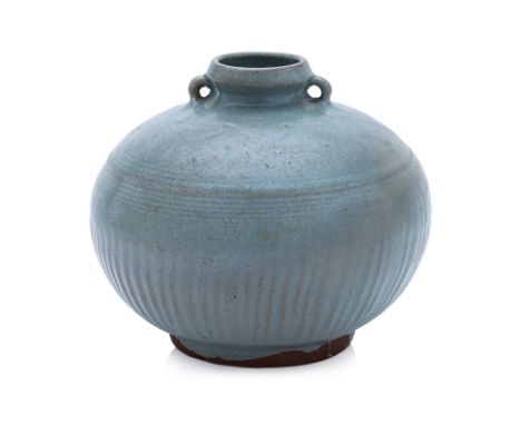 A THAI CELADON BOTTLE
Sawakhalok, 15th Century, a heavily potted globular bottle with two lugs, incised ribbed sides and comb
