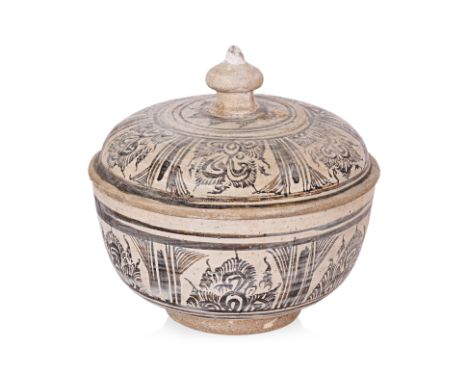 A LARGE THAI BOWL AND COVER
Sukhothai, 14th-15th Century, stoneware slip decorated and painted in six panels of feathery foli