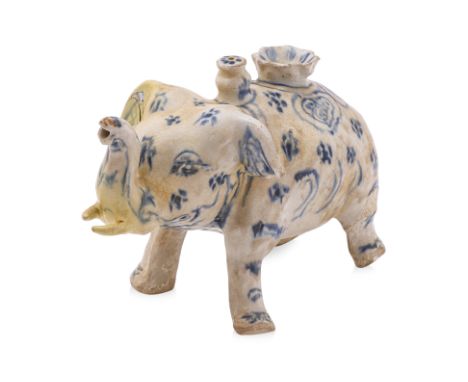 A VIETNAMESE BLUE AND WHITE ELEPHANT FORM EWER
15th /16th Century, modelled standing four square, with an opening to its back