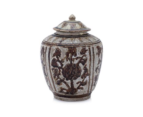 A THAI SGRAFFITO JAR AND COVER Sawankhalok, 14th-15th Century, decorated with four floral panels and triangular bands, dark b