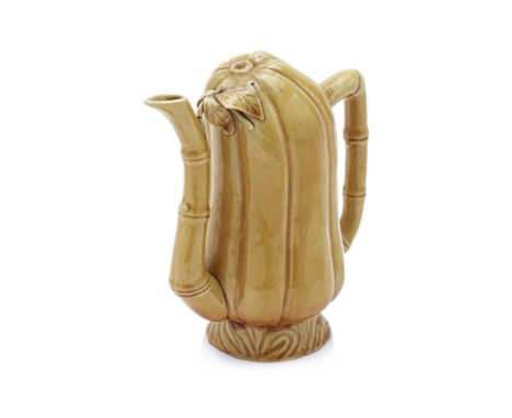 A YELLOW-GLAZED 'CADOGAN' TYPE TEAPOT Late Qing-Republic, gourd form with bamboo handle and spout, everted base with impresse