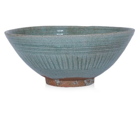 A LARGE THAI CELADON BOWL Sawankhalok, 14th-15th Century, a tall wide bowl with incised underglaze patterned lattice walls, r