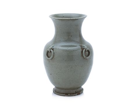 A YUE-TYPE ARCHAISTIC INCISED CELADON VASE
Hu shaped vase with four rings to shoulders, underglaze decorated ruyi head panels