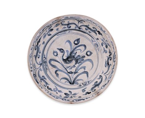 A VIETNAMESE BLUE AND WHITE DUCK DISH
15th Century, the centre is decorated with a duck standing among flower buds and reeds,