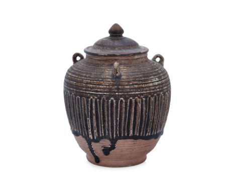 A THAI BROWN-GLAZED JAR AND COVER
Sawankhalok, 14th-15th Century, an ovoid jar with three lugs to shoulders, domed cover with