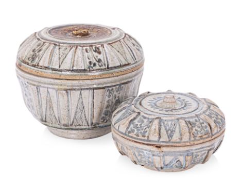TWO THAI LOBED JARS AND COVERS
Sawankhalok, 15th Century, a smaller and larger example of similar circular form with ribbed s