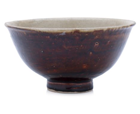 A VIETNAMESE TWO COLOUR GLAZED BOWL 14th Century, dark brown glazed exterior, everted rim and cream white glaze to the interi