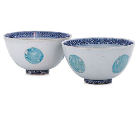 TWO BLUE AND WHITE AND ENAMELLED BOWLS
Ming Dynasty, decorated with a peony and scroll medallion to well and lattice band, th