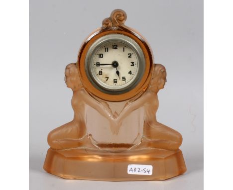 An Art Deco pressed glass mantel clock.