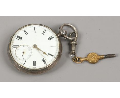 A Victorian silver cased pocket watch. With enamel dial incorporating subsidiary seconds. Assayed London 1882.