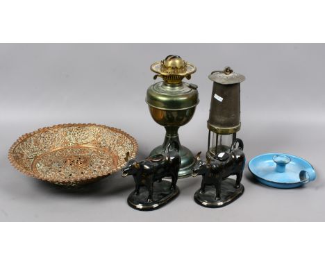 A vintage miners safety lamp, brass based oil lamp, Jackfield cow creamers, enamel chamber stick and an Indian pierced copper