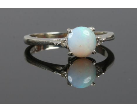 A white gold opal and diamond ring size P