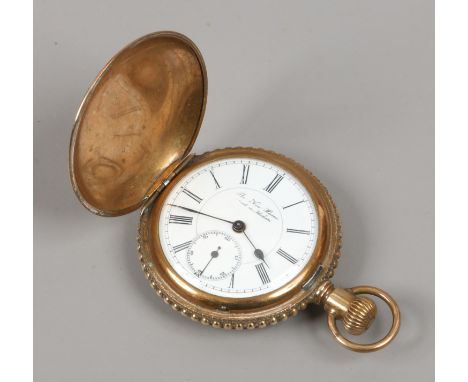 An early C20th gold plated full hunter pocket watch with ornate chased decoration to the case having a white enamel dial and 