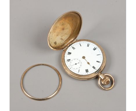 A vintage gold plated full hunter pocket watch with white enamel dial, Roman numeral markers and subsidiary seconds. Conditio