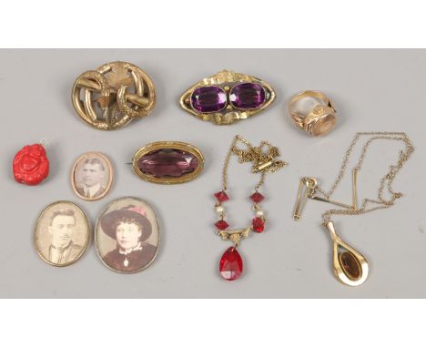 A box of Pinchbeck jewellery etc including knot brooch, amethyst brooches, photo and cocktail watch ring.