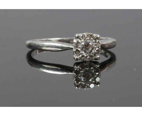 A 9ct white gold diamond cluster ring, size O 1/2.