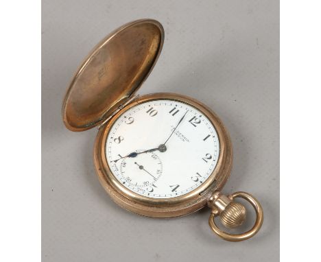 A gold plated full hunter pocket watch by J. W. Benson of London with white enamel dial Arabic numeral markers and subsidiary