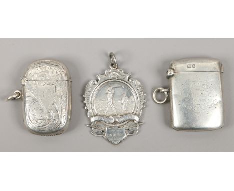 Two silver vesta cases, one marked Wilkinson Cup 1905 along with a silver Pretoria Golf Club medal 58.54 grams.