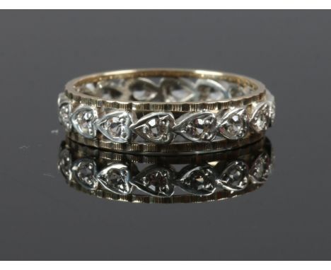 A 9ct gold and silver eternity ring set with white paste stones size N.