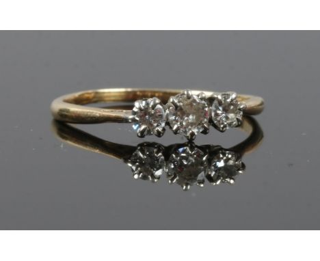 An 18ct gold three stone diamond ring, size Q.