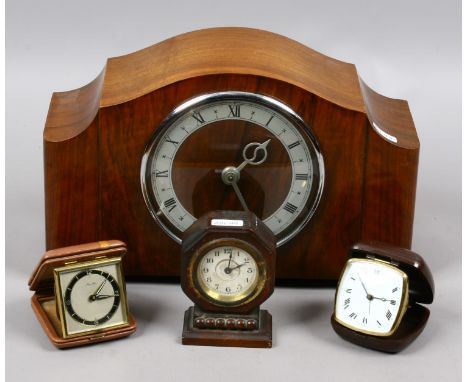 A Smiths walnut cased electric mantel clock and three travel clocks.