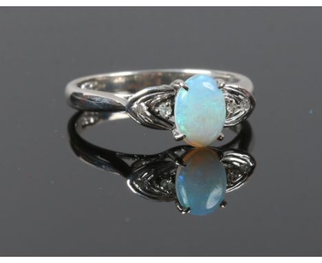 A Chinese white gold opal and diamond ring, size K.