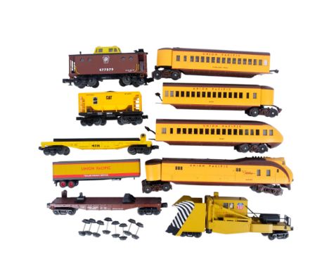 A collection of M.T.H. HO gauge railway engines and carriages, including a Rail King caboose 477879, a Cat Journal Pack 32010