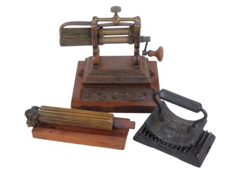 A Victorian brass and cast-iron table-top crimping machine, and a similar separate roller, H20cm