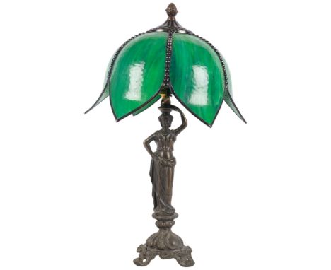 Art Nouveau style table lamp, with leadlight green glass shade, supported by spelter figure of a lady, H51cm