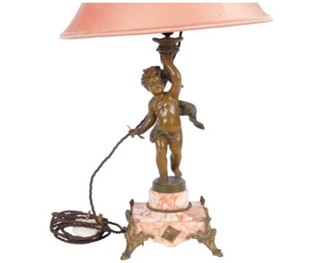 A brass cherub figure table lamp on marble plinth and 4 feet, with shade, H63cm overall