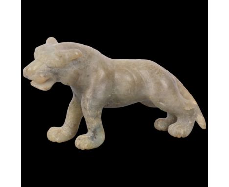 A Chinese carved and polished jade tiger figure, L21cm