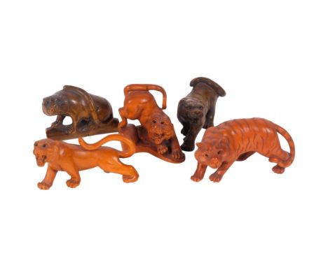 A group of Japanese carved wood tiger netsuke, signed, largest 6.5cm