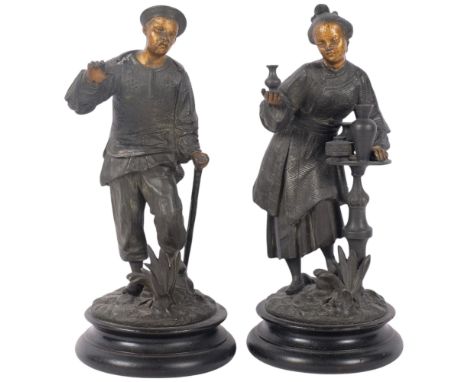 A pair of Vintage patinated spelter Oriental figures, on circular wooden plinths, 28cm