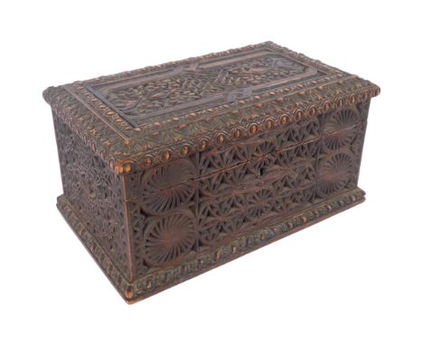 A large Celtic? carved oak tea caddy box, with intricate knot cover, allover chipped carved decoration, and 2 interior fitted