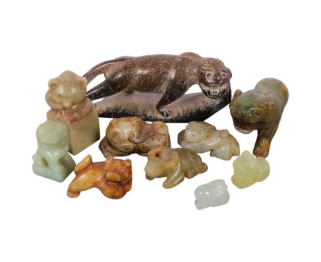 A group of Chinese carved jade and soapstone animal figures, including panda and tiger, largest 14cm
