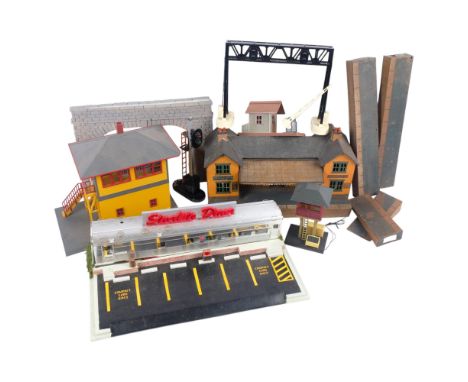 A collection of various station and track buildings, gantries, and tunnel mounts, including MTH Hobart signal box, other sign