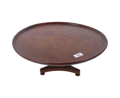 Antique mahogany lazy Susan, on baluster pedestal and tripod base, 43cm across