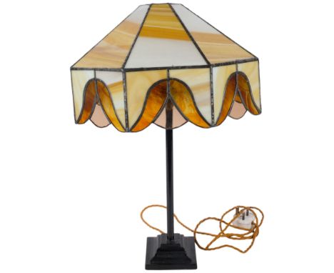 A Vintage cast-iron table lamp on stepped plinth, with Tiffany style leadlight glass shade of octagonal form, H55cm